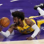 Los Angeles Lakers guard Wesley Matthews tries to pass the ball from the floor during the first half of an NBA basketball game against the Phoenix Suns Tuesday, March 2, 2021, in Los Angeles. (AP Photo/Mark J. Terrill)