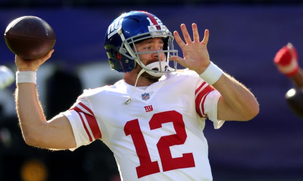 Quarterback Colt McCoy #12 of the New York Giants warms up against the Baltimore Ravens at M&T Bank...