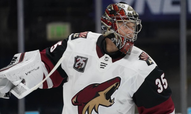 Arizona Coyotes goaltender Darcy Kuemper prepares for play to resume after a timeout in the first p...