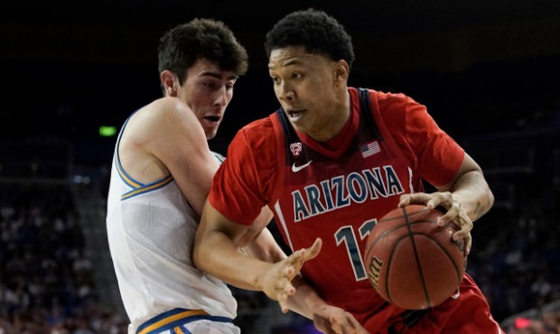 Arizona forward Ira Lee, right, drives around UCLA guard Jaime Jaquez Jr. during the first half of ...