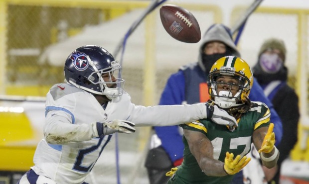 Green Bay Packers' Davante Adams catches a pass in front of Tennessee Titans' Malcolm Butler during...