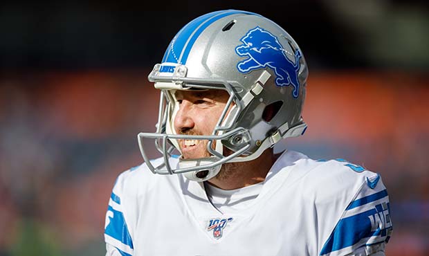 Place kicker Matt Prater #5 of the Detroit Lions smiles on the field before a game against the Denv...