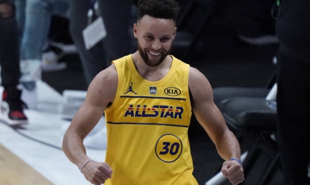 Golden State Warriors guard Stephen Curry celebrates after winning the 3-point contest at basketbal...