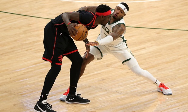 Pascal Siakam #43 of the Toronto Raptors is defended by Torrey Craig #3 of the Milwaukee Bucks duri...