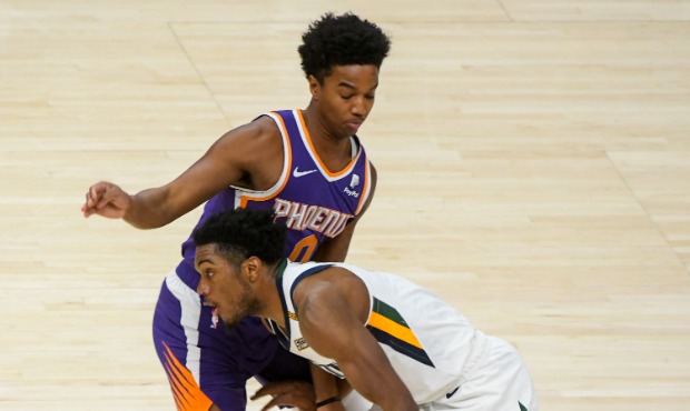 Trent Forrest #3 of the Utah Jazz drives against Ty-Shon Alexander #0 of the Phoenix Suns during a ...
