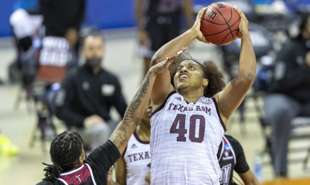 Texas A&M center Ciera Johnson (40) looks for the basket over Troy forward Alexus Dye during the fi...