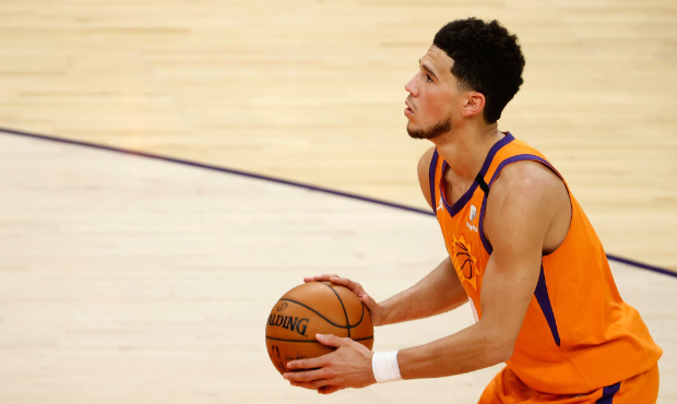 Devin Booker #1 of the Phoenix Suns shoots a free-throw shot against the Oklahoma City Thunder duri...