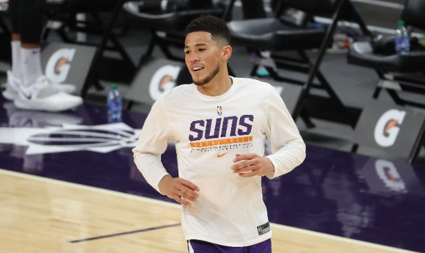 Devin Booker #1 of the Phoenix Suns warms up before the game against the Minnesota Timberwolves at ...