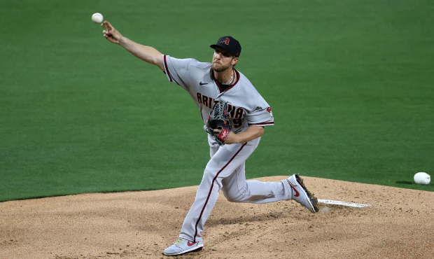 Merrill Kelly #29 of the Arizona Diamondbacks pitches during the first inning of a game against the...
