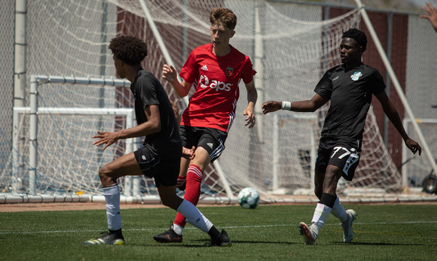 Phoenix Rising defender Niall Dunn (middle) plays against Colorado Springs Switchbacks in a preseas...