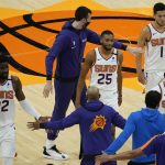 The Phoenix Suns celebrate during a time out during the second half of an NBA basketball game against the Sacramento Kings, Thursday, April 15, 2021, in Phoenix. (AP Photo/Matt York)