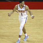 Phoenix Suns guard Devin Booker (1) reacts after a play against the Houston Rockets during the first quarter of an NBA basketball game in Houston, Monday, April 5, 2021. (Troy Taormina/Pool Photo via AP)