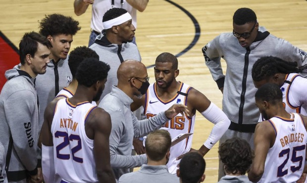 Phoenix Suns head coach Monty Williams talks with his team before a game against the Houston Rocket...