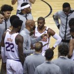 Phoenix Suns head coach Monty Williams talks with his team before a game against the Houston Rockets in an NBA basketball game in Houston, Monday, April 5, 2021. (Troy Taormina/Pool Photo via AP)