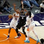 Phoenix Suns forward Jae Crowder (99) fouls Sacramento Kings forward Maurice Harkless (8) during the first half of an NBA basketball game, Thursday, April 15, 2021, in Phoenix.(AP Photo/Matt York)