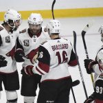 Arizona Coyotes right wing Phil Kessel, second from left, is congratulated after scoring against the Los Angeles Kings during the third period of an NHL hockey game Saturday, April 24, 2021, in Los Angeles. (AP Photo/Michael Owen Baker)