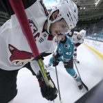 Arizona Coyotes defenseman Oliver Ekman-Larsson (23) battles for the puck along the boards against San Jose Sharks left wing John Leonard (43) during the third period of an NHL hockey game Wednesday, April 28, 2021, in San Jose, Calif. (AP Photo/Tony Avelar)