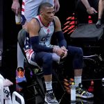 Washington Wizards guard Russell Westbrook (4) watches from the bench during the second half of an NBA basketball game against the Phoenix Suns, Saturday, April 10, 2021, in Phoenix. (AP Photo/Matt York)