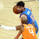 Oklahoma City Thunder guard Ty Jerome looks to drive on Phoenix Suns guard Jevon Carter (4) during the first half of an NBA basketball game Friday, April 2, 2021, in Phoenix. (AP Photo/Rick Scuteri)