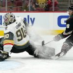 Arizona Coyotes left wing Michael Bunting, right, gets the puck past Vegas Golden Knights goaltender Robin Lehner (90) for a goal during the third period of an NHL hockey game Friday, April 30, 2021, in Glendale, Ariz. The Coyotes won 3-0. (AP Photo/Ross D. Franklin)