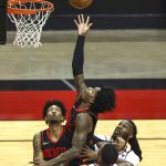 Houston Rockets guard Kevin Porter Jr., top, shoots against the Phoenix Suns during the first quarter of an NBA basketball game in Houston, Monday, April 5, 2021. (Troy Taormina/Pool Photo via AP)