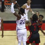 Phoenix Suns center Deandre Ayton (22) dunks against Houston Rockets guard Kevin Porter Jr. (3) during the third quarter of an NBA basketball game in Houston, Monday, April 5, 2021. (Troy Taormina/Pool Photo via AP)