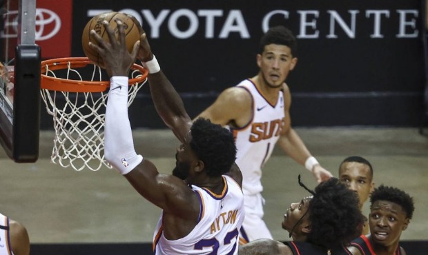 Phoenix Suns center Deandre Ayton (22) dunks against Houston Rockets guard Kevin Porter Jr. (3) dur...