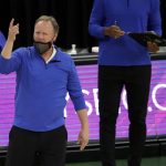 Milwaukee Bucks head coach Mike Budenholzer signals for a call to be reviewed during the second half of an NBA basketball game against the Phoenix Suns Monday, April 19, 2021, in Milwaukee. (AP Photo/Aaron Gash)