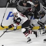 Arizona Coyotes left wing Michael Bunting (58) advances the puck against the Los Angeles Kings during the second period of an NHL hockey game Saturday, April 24, 2021, in Los Angeles. (AP Photo/Michael Owen Baker)