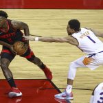 Houston Rockets forward Jae'Sean Tate (8) dribbles the ball against Phoenix Suns guard Devin Booker (1) during the first quarter of an NBA basketball game in Houston, Monday, April 5, 2021. (Troy Taormina/Pool Photo via AP)