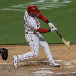 Cincinnati Reds' Kyle Farmer hits a two-run home run during the sixth inning of the team's baseball game against the Arizona Diamondbacks in Cincinnati, Tuesday, April 20, 2021. (AP Photo/Aaron Doster)