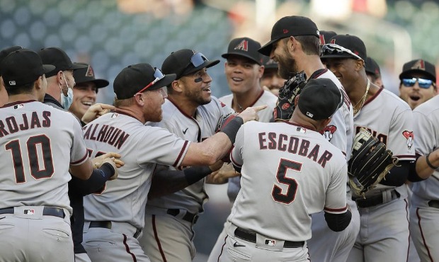 Arizona Diamondbacks pitcher Madison Bumgarner, center right, is congratulated after pitching a sev...