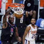 Los Angeles Clippers forward Kawhi Leonard (2) dunks against the Phoenix Suns during the second half of an NBA basketball game Thursday, April 8, 2021, in Los Angeles. (AP Photo/Marcio Jose Sanchez)