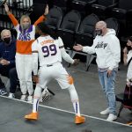 Phoenix Suns forward Jae Crowder (99) celebrates a three pointer with fans during the first half of an NBA basketball game against the Houston Rockets, Monday, April 12, 2021, in Phoenix. (AP Photo/Matt York)