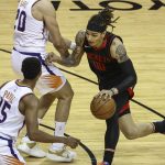 Houston Rockets forward D.J. Wilson (00) drives against the Phoenix Suns during the first quarter of an NBA basketball game in Houston, Monday, April 5, 2021. (Troy Taormina/Pool Photo via AP)
