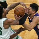Boston Celtics guard Marcus Smart (36) and Phoenix Suns guard Devin Booker (1) compete for the ball in the first half of an NBA basketball game, Thursday, April 22, 2021, in Boston. (AP Photo/Elise Amendola)