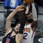 Los Angeles Clippers center Ivica Zubac (40) vies for a rebound against Phoenix Suns center Deandre Ayton during the second half of an NBA basketball game Thursday, April 8, 2021, in Los Angeles. (AP Photo/Marcio Jose Sanchez)