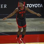 Houston Rockets forward Jae'Sean Tate (8) reacts after making a basket against the Phoenix Suns to tie the game during the fourth quarter of an NBA basketball game in Houston, Monday, April 5, 2021. (Troy Taormina/Pool Photo via AP)