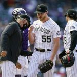 Colorado Rockies starting pitcher Jon Gray, center, is pulled from the mound by manager Bud Black, left, as first baseman Josh Fuentes looks on in the seventh inning of a baseball game against the Arizona Diamondbacks Thursday, April 8, 2021, in Denver. (AP Photo/David Zalubowski)