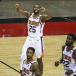Phoenix Suns forward Mikal Bridges (25) reacts after a play against the Houston Rockets during the second quarter of an NBA basketball game in Houston, Monday, April 5, 2021. (Troy Taormina/Pool Photo via AP)