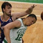
              The ball gets away from Boston Celtics forward Grant Williams (12) and Phoenix Suns forward Dario Saric, left, in the first half of an NBA basketball game, Thursday, April 22, 2021, in Boston. (AP Photo/Elise Amendola)
            