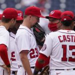 
              Washington Nationals relief pitcher Erick Fedde (23) talks with pitching coach Jim Hickey, third from right, and others during the fifth inning of a baseball game against the Arizona Diamondbacks at Nationals Park, Saturday, April 17, 2021, in Washington. (AP Photo/Alex Brandon)
            