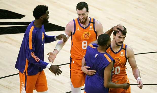 Phoenix Suns forward Frank Kaminsky (8) and forward Dario Saric (20) celebrate with teammates durin...
