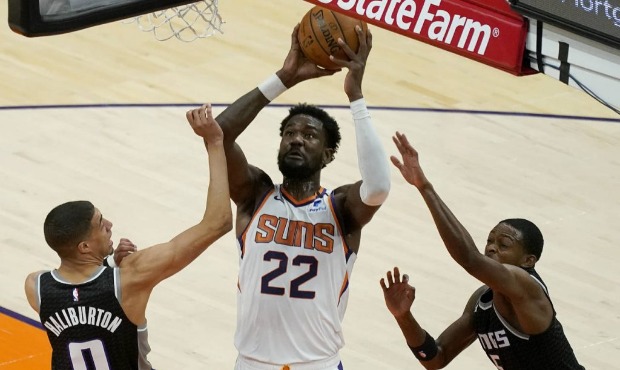 Phoenix Suns center Deandre Ayton (22) shoots as Sacramento Kings guard Tyrese Haliburton (0) defen...