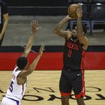 Houston Rockets forward Sterling Brown (0) shoots against Phoenix Suns guard Cameron Payne (15) during the first quarter of an NBA basketball game in Houston, Monday, April 5, 2021. (Troy Taormina/Pool Photo via AP)