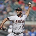 Arizona Diamondbacks pitcher Madison Bumgarner works against the Atlanta Braves in the first inning of the second baseball game of a double header, Sunday, April 25, 2021, in Atlanta. (AP Photo/Ben Margot)