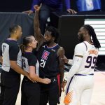 Phoenix Suns forward Jae Crowder (99) grabs Los Angeles Clippers guard Patrick Beverley (21) by the arm after Beverley fouled Suns guard Chris Paul during the second half of an NBA basketball game Thursday, April 8, 2021, in Los Angeles. Beverley was ejected for a flagrant foul. (AP Photo/Marcio Jose Sanchez)