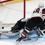 Arizona Coyotes left wing Michael Bunting, right, scores his third goal of the game on Los Angeles Kings goaltender Calvin Petersen during the second period of an NHL hockey game Monday, April 5, 2021, in Los Angeles. (AP Photo/Mark J. Terrill)