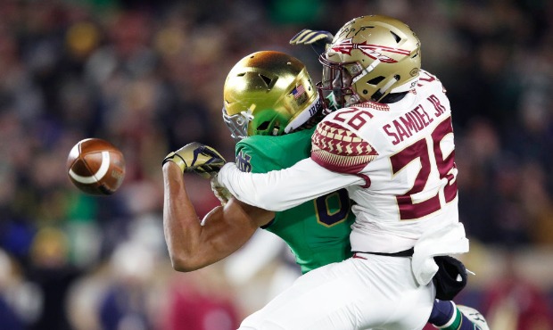 Asante Samuel Jr. #26 of the Florida State Seminoles breaks up a pass against Chase Claypool #83 of...