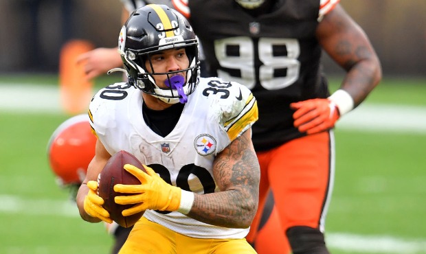 James Conner #30 of the Pittsburgh Steelers carries the ball against the Cleveland Browns in the th...